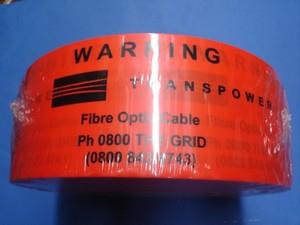 Hazard-Strip-Transpower-85mm-x-80mu-x-500mtr-(orange-tape/black-print)-(32131)